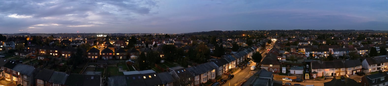 Beautiful Aerial View of British City and Roads at Night. Drone's High Angle Footage of Illuminated British Town photo
