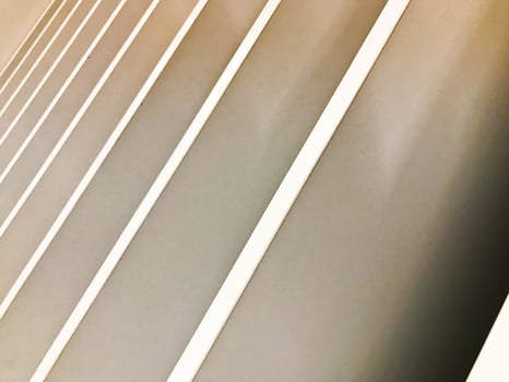 Beautiful abstract texture of wooden gray diagonal boards at an angle. The background photo
