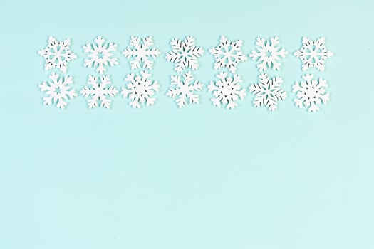 Set of white snowflakes on colorful background. Top view of Christmas ornament. New Year time concept with empty space for your design photo