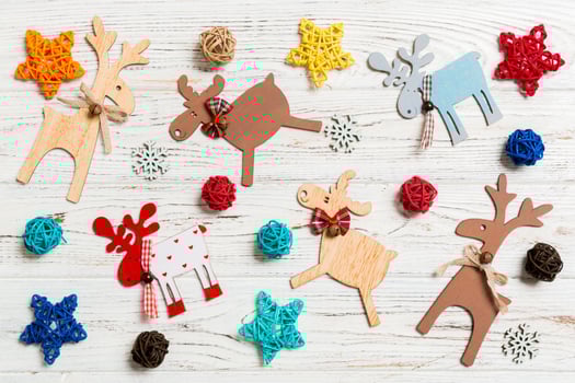 Top view of Christmas toys on wooden background. New Year ornament. Holiday concept photo
