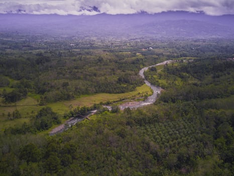 aerial view of river and mountain on sunny morning photo