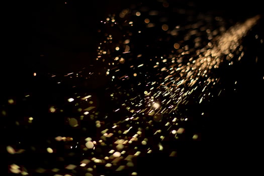 Sparks in dark. Metal grinding lights. Details of grinder's work. photo