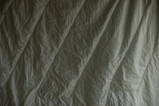 White blanket dries. Wet blanket. Bed linen texture. photo