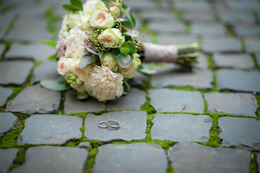 Two wedding rings on the floor with contrast photo