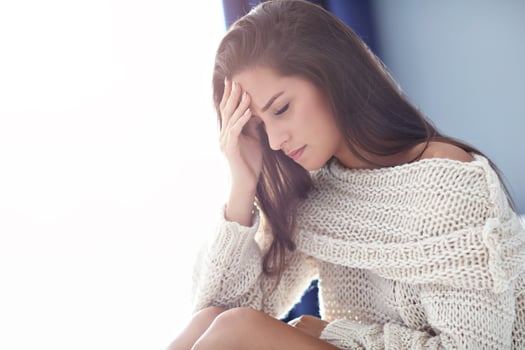 Adult woman suffering from headache at home photo