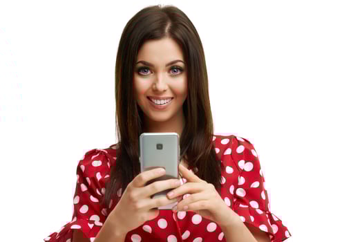 Caucasian brunette woman using smartphone isolated over white background photo