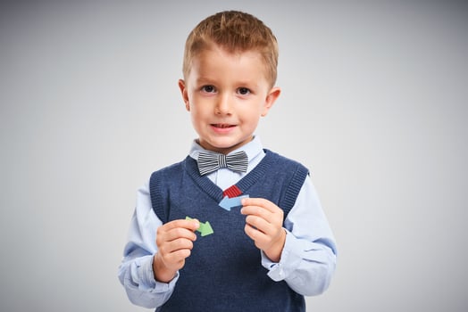 Portrait of a 4 year old boy posing over white with arrows photo