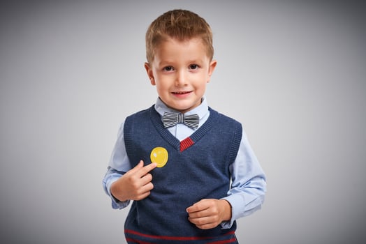 Portrait of a 4 year old boy posing over white with badge photo