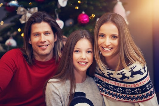 Beautiful family celebrating Christmas at home photo