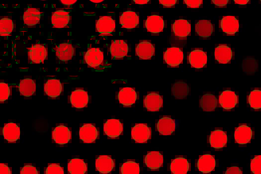 Unfocused abstract red bokeh on black background. defocused and blurred many round light photo