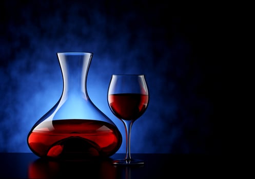 Carafe and Red Wine Glass with Textured Blue Background - 3D Illustration photo