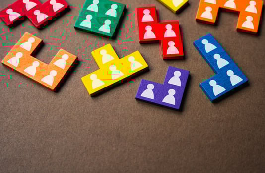 Puzzle pieces symbolizing people and workers. Work resources, employees. Hiring candidates. Society and social groups. Human resource management. Marketing and market segmentation. photo