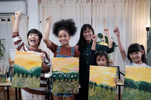 Group of art people in classroom studio, a teacher and student kids proud show painting work, an acrylic color picture on canvas, creative learning with talents skill at elementary school education. photo