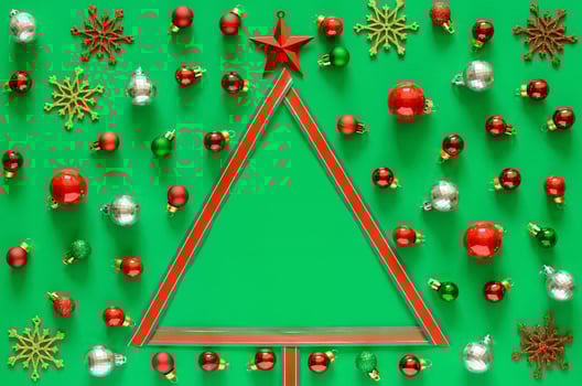 Colorful baubles ornament and ribbon set and Christmas tree on green background with space for text. Christmas holiday concept. photo