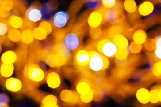 dark yellow and violet twinkling Christmas lights photo