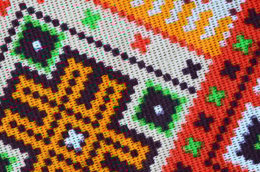 Traditional Ukrainian folk art knitted embroidery pattern on textile fabric photo