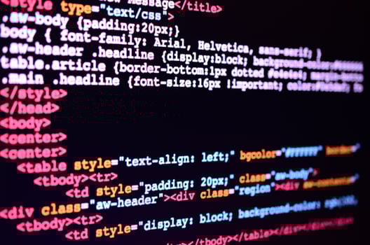 Macro shot of the command line on the monitor of the office computer. The concept of the programmer's work. Information line flow photo