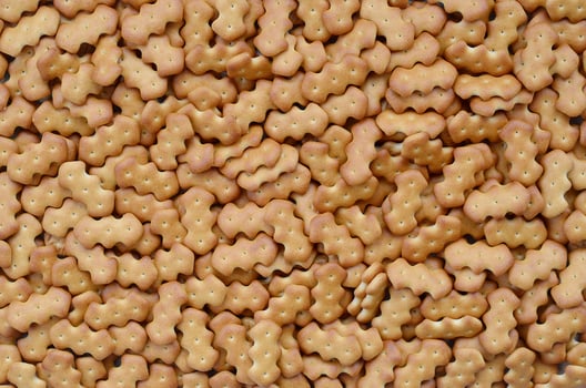 Pattern of a many yellow salted crackers photo