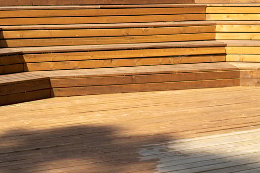 Wooden steps. Place for students to relax. Wooden benches. Scene details. Tribune for speeches. photo