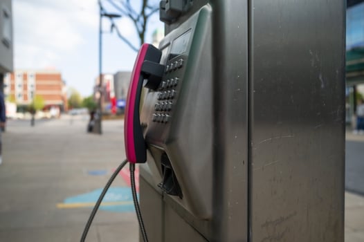 public phone on the street in european city photo