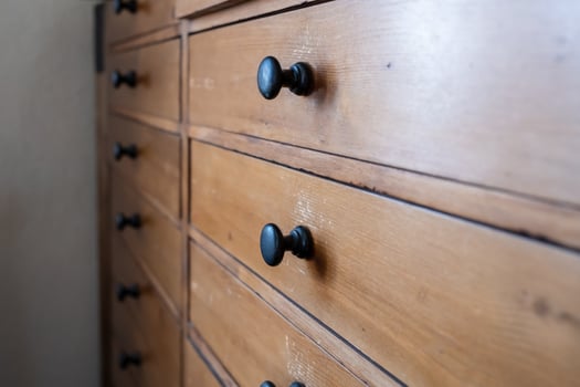 Close-up of an old wooden chest with drawers, for storage. photo