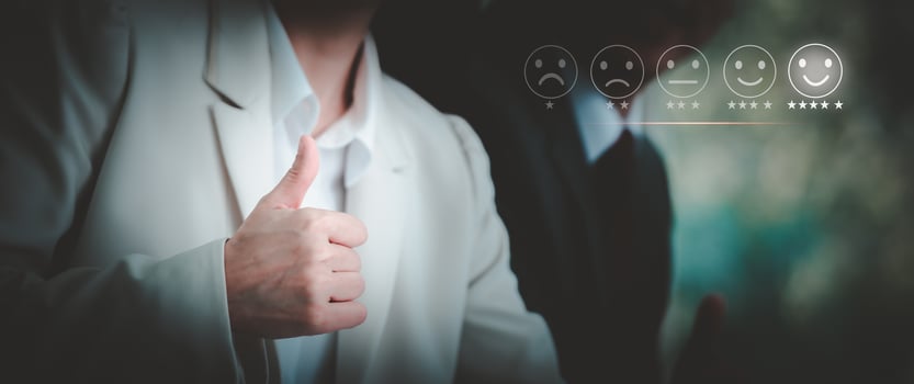Businesswoman showing thumbs up for customer services satisfaction, smiling face emoticon. Customer service evaluation concept. photo