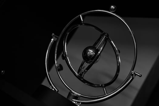 A brilliant pendulum is a perpetual motion machine in the form of spinning spheres. photo