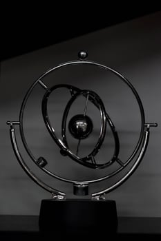 A brilliant pendulum is a perpetual motion machine in the form of spinning spheres. photo