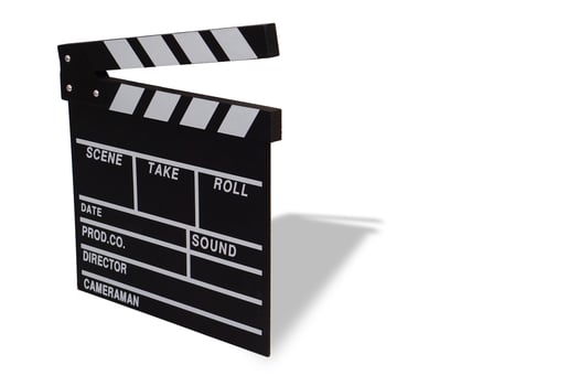 Clapperboard or movie slate black color on white background. Cinema industry, video production and film concept. photo