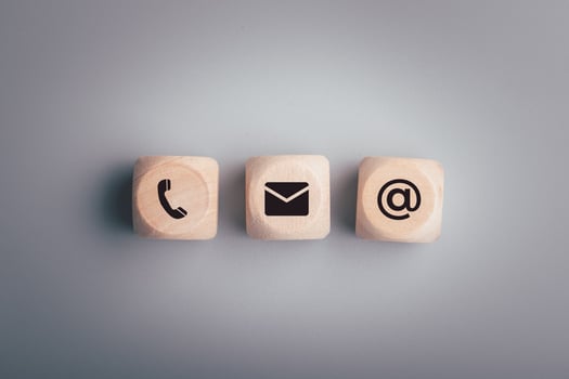 The wooden dice has a symbol. Contact us or the Customer support hotline people connect. photo