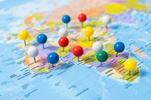 various locations with pins, push pin on map closeup photo