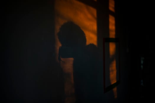 Light on wall in morning. Dawn in interior. Glare of yellow light in house. photo