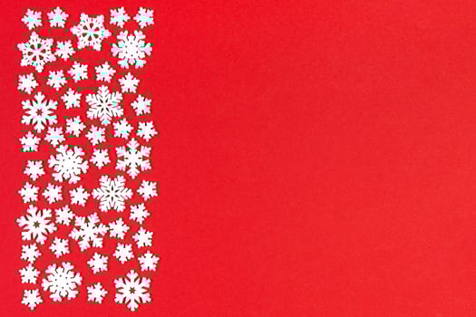 Set of white snowflakes on colorful background. Top view of Christmas ornament. New Year time concept with empty space for your design photo