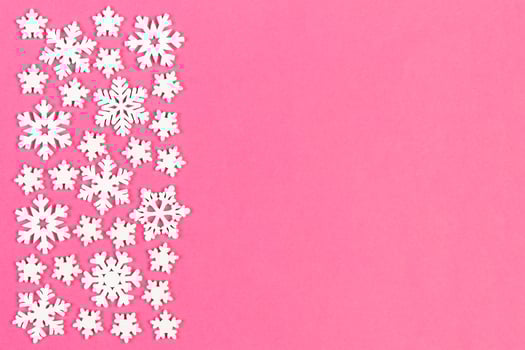 Set of white snowflakes on colorful background. Top view of Christmas ornament. New Year time concept with empty space for your design photo