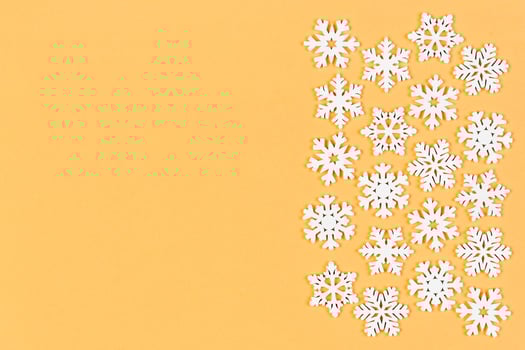 Top view of winter ornament made of white snowflakes on colorful background. Happy New Year concept with copy space photo
