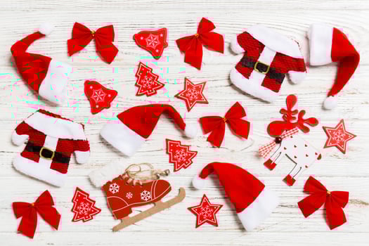 Top view of Christmas toys on wooden background. New Year ornament. Holiday concept photo