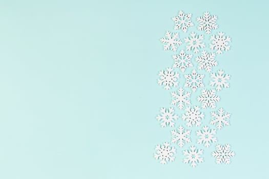 Set of white snowflakes on colorful background. Top view of Christmas ornament. New Year time concept with empty space for your design photo