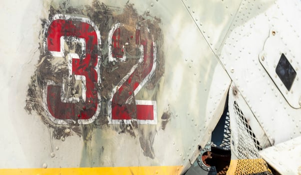 Detail of the Mi-24 helicopter. Remains of a destroyed Russian Air Force combat helicopter Hind Crocodile. Engine rotor, blades, tail, wreckage of a crashed military attack helicopter close-up. photo