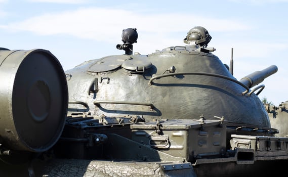 Tower of an armored personnel carrier or tank. Heavy weapons of war, sky background. Army equipment for combat and defense. Cannon tower. Details of military equipment. Close-up. photo