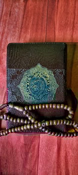 The portrait of tasbih and the Koran is very synonymous with Muslims photo