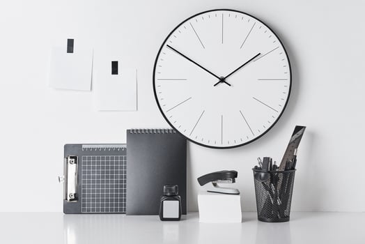 Office supplies, sticky and round clock on white photo