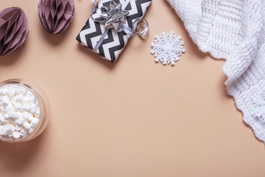 Christmas hugge flat lay composition with paper balls, plaid and march mellow. Winter holiday concept photo