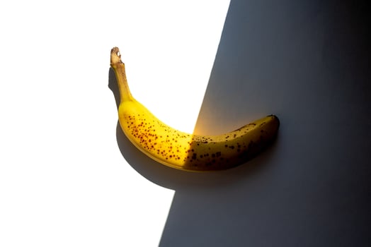 Ripe banana light and shadow background photo