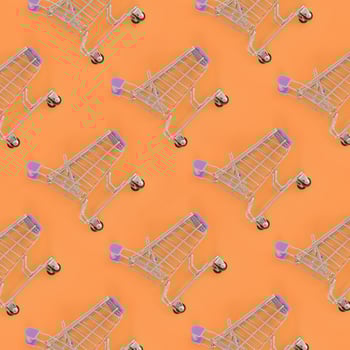 Shopping addiction, shopping lover or shopaholic concept. Many small empty shopping carts perform a pattern on a pastel colored paper background. Flat lay composition, top view photo
