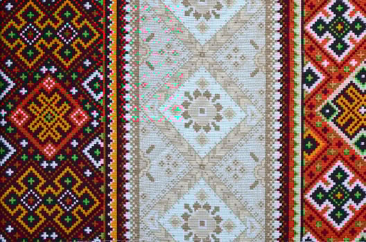 Traditional Ukrainian folk art knitted embroidery pattern on textile fabric photo