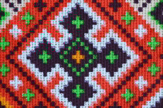 Traditional Ukrainian folk art knitted embroidery pattern on textile fabric photo