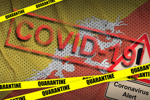 Bhutan flag and Covid-19 quarantine yellow tape with red stamp. Coronavirus or 2019-nCov virus photo