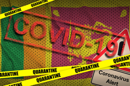 Sri Lanka flag and Covid-19 quarantine yellow tape with red stamp. Coronavirus or 2019-nCov virus photo