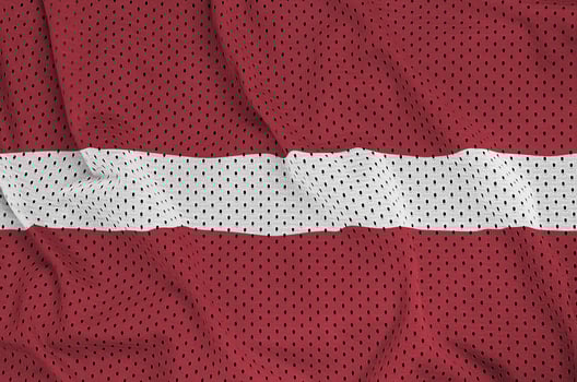 Latvia flag printed on a polyester nylon sportswear mesh fabric photo