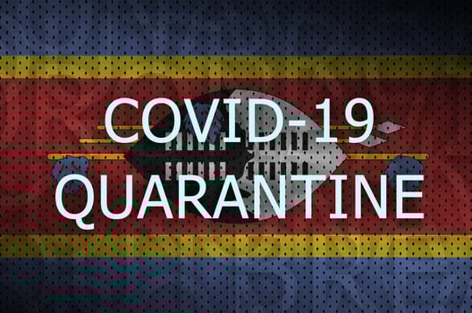 Swaziland flag and Covid-19 quarantine inscription. Coronavirus or 2019-nCov virus photo